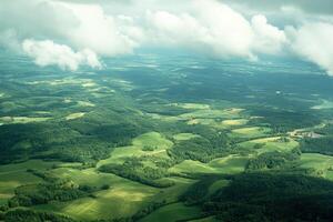 Vast green fields and rolling hills under a cloudy sky photo