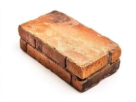 Brick block with textured surface on white background photo