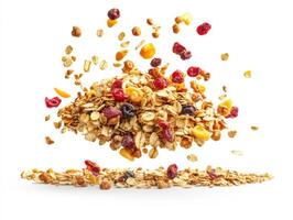 Crunchy granola and dried fruit scatter against a white background photo