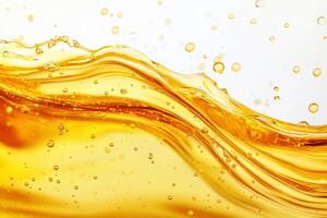 Flowing golden liquid with bubbles against white background photo
