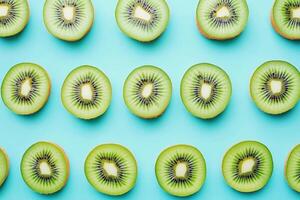 Freshly sliced kiwi arranged on a vibrant blue background photo