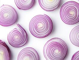 Sliced red onions arranged in a circular pattern on a white background photo