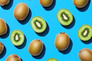 Fresh kiwi fruits arranged on a vibrant blue background photo