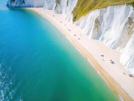 Stunning coastal view of white cliffs and sandy beach in summer photo