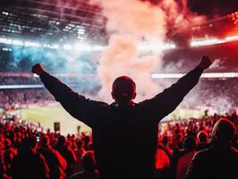 Fans celebrate victory at an exciting soccer match in the stadium photo