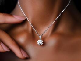 Elegant necklace with a sparkling pendant highlighted on skin photo
