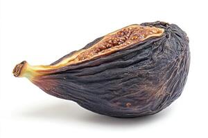 Dried fig displaying rich texture and color against clean background photo