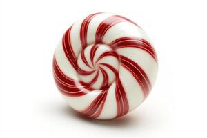 Swirled candy on a white surface with vibrant red and white colors photo