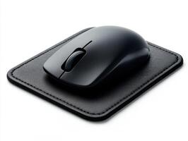 Black computer mouse placed on a textured mousepad photo