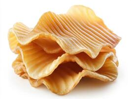 Crispy golden potato chips stacked on a white background photo
