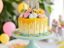 Celebrate with a colorful, floral cake adorned with candles photo