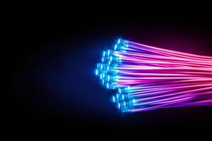 Bundle of optical fibers transmitting data with light beams on black background photo