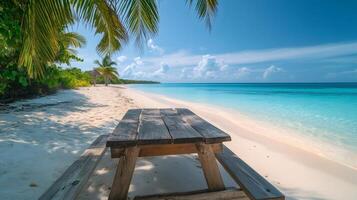 Wooden picnic table inviting relaxation on tropical beach paradise photo