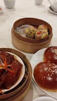 A table with plates of food and bowls of soup video