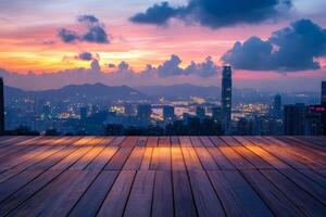 Wooden floor overlooking illuminated hong kong skyline at sunset with colorful clouds photo