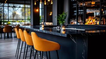 Modern restaurant bar with yellow chairs and lit candles showing elegance photo