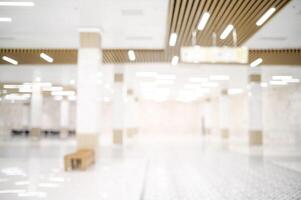 An empty hallway with a lot of light coming from the ceiling photo