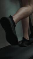 Man exercises at home with a treadmill run, staying active and maintaining fitness indoors. video