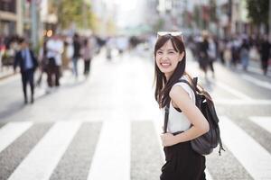 The rhythm of Tokyo, Unseen faces in the crowd, a harmonious blend of business and fashion in the city. photo