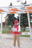 female tourist woman holding map exploring new city and talking on the phone photo
