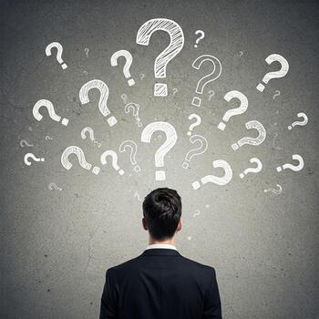 Businessman thinking about question marks on concrete background photo