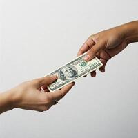 Two hands holding a dollar bill photo