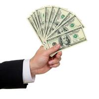 A man in a suit holding a stack of cash photo
