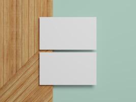 Minimalist business card mockup on wood and mint green background, perfect for showcasing your design ideas. photo