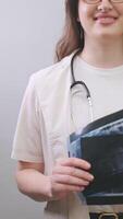 Dentist conducts a thorough examination, comparing X-rays to detect hidden dental issues and diagnose accurately. video