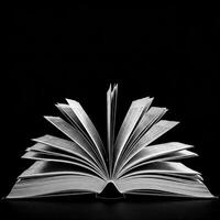 An open book on a black background photo
