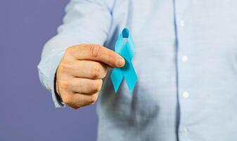 Support awareness for men's health with blue ribbon for cancer prevention photo