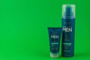 24.03.25 Lviv Ukraine Shaving products for men displayed on green background photo