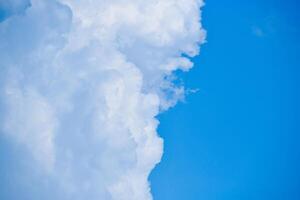 A plane flying through a cloud filled sky photo