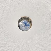 A view of the sky from inside a circular hole photo