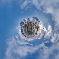 A small planet with a boat in the middle photo