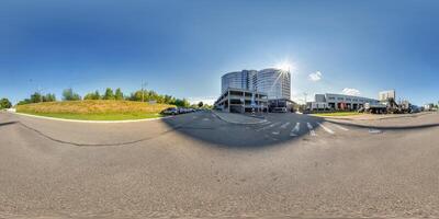 hdri 360 panorama on road near modern business office building with multi-level parking in equirectangular seamless spherical projection. VR content photo