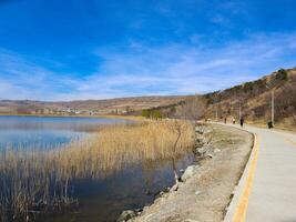 Lakefront Trail in Spring with Hikers and Cyclists photo