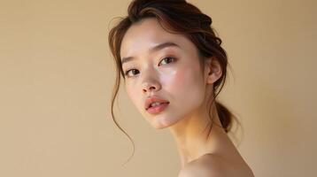 A woman with a soft, ethereal glow in a minimalist setting. photo