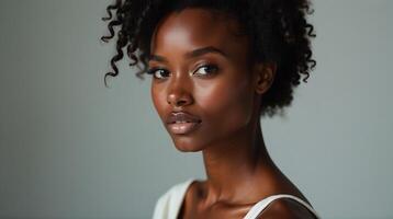 Elegant and poised, the model exudes a natural beauty with a soft, subtle makeup application. photo