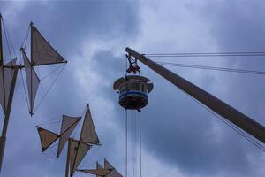 Genova, Liguria, Italy. Sculptural elevator for short trips, similar to a crane. Cabins offer panoramic views of the city and harbor photo