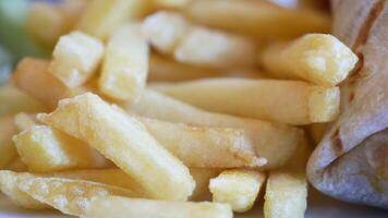 Enjoying crispy fries and a delicious wrap at a local eatery video
