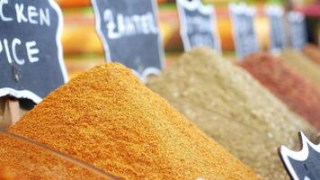 Colorful spices displayed at local market in vibrant setting video