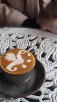 Coffee art featuring intricate design on a stylish table setting video
