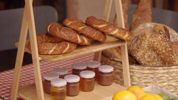 Fresh breads and pastries displayed in cozy bakery setting video