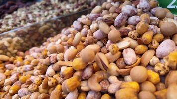Variety of nuts displayed at local market during daytime video