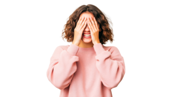 Brunette woman hides face with hands, smiling against black, cut out transparent png