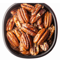 Delicious Caramelized Pecans in a Dark Serving Bowl with a Glossy Finish for Culinary Use png
