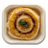 Delicious Swirled Cinnamon Roll with Icing and Garnish in Eco-Friendly Container png