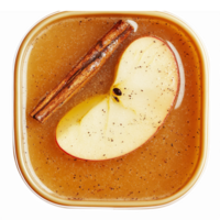 Sliced Apple Cinnamon Brew in Clear Bowl with Sugar Spice Garnish for Fall Desserts and Drinks png