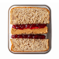 Peanut Butter and Jelly Sandwich on Whole Wheat Bread Featuring Smooth Peanut Butter and Red Jam png